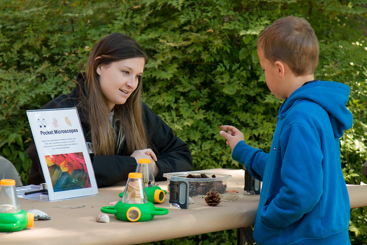 Child interacting with a nature activity.