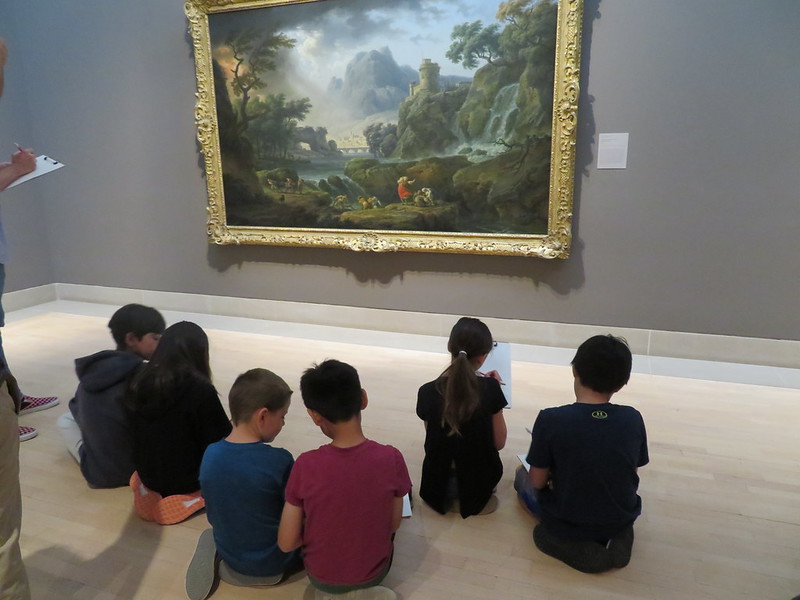 Children participating in an activity in an art gallery. 