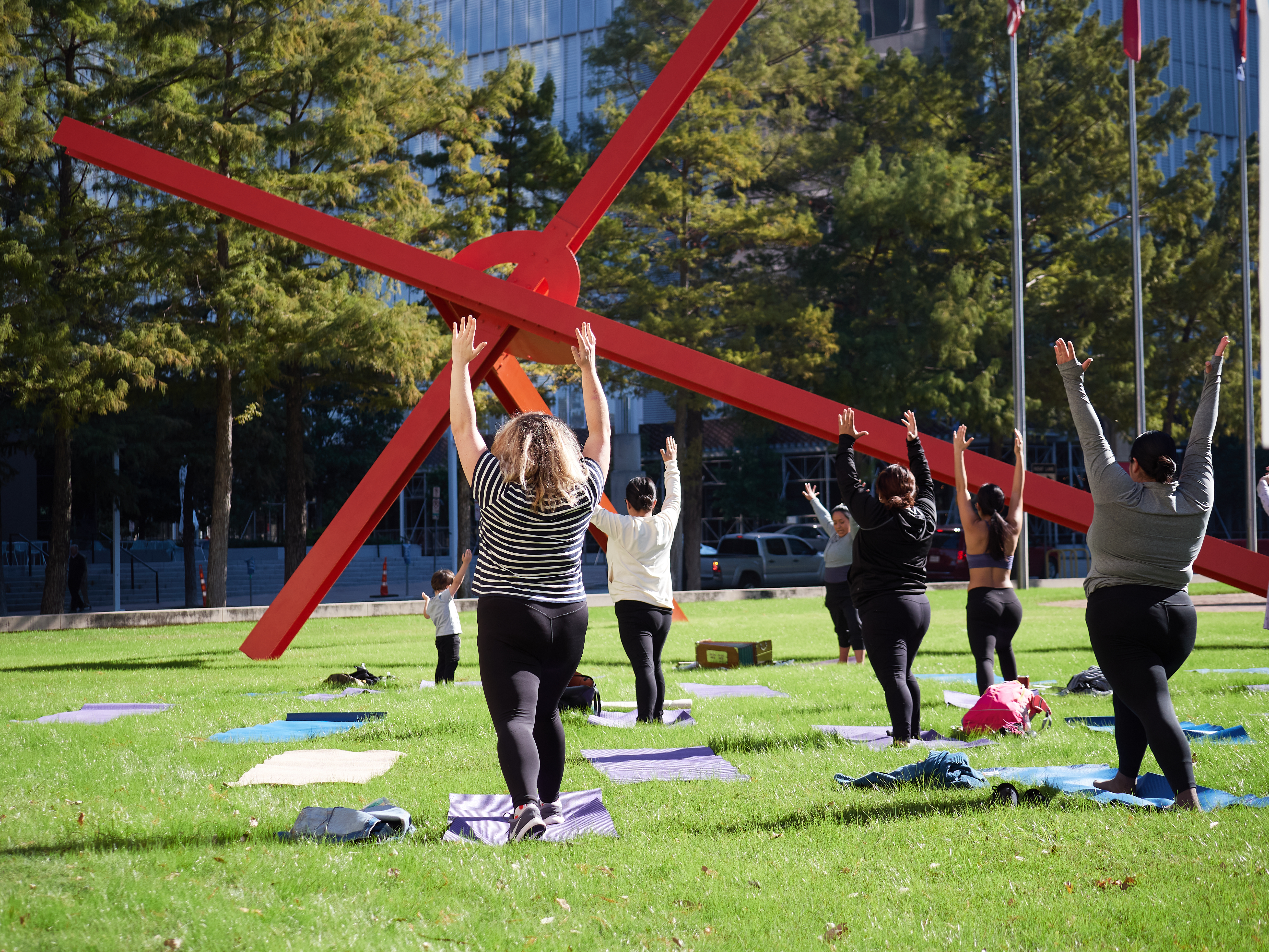 Group of people doing yoga.